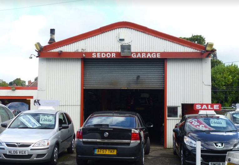 Sedor Garage workshop on Station Road, with its red fascia and open garage door